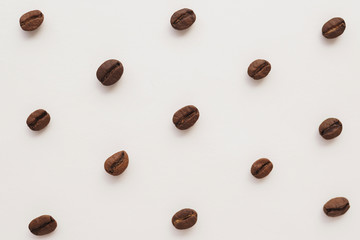 coffee beans on a white background pattern top view