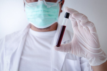 Medical researchers wear masks and latex gloves to prevent germs Showing the blood vessels of the...