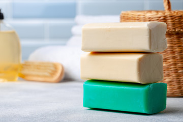 Soap bars with natural ingredients on the table, close up.