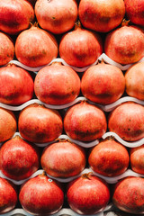 Pomegranate fruit rows on the farmers market