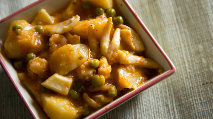 Stewed seafood with potatoes and vegetables