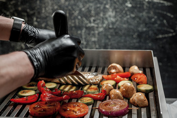cooking fish with grilled vegetables in the kitchen