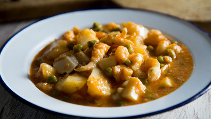 Stewed seafood with potatoes and vegetables