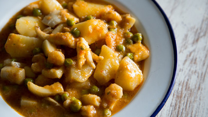Stewed seafood with potatoes and vegetables