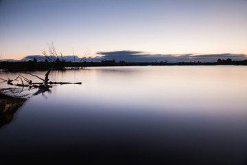 Naklejka na ściany i meble Beautiful sunset on the lake,natural background, long shutter speed