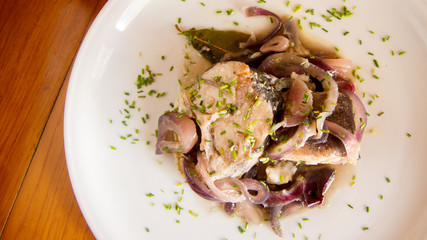 Fish with onion in a spanish restaurant