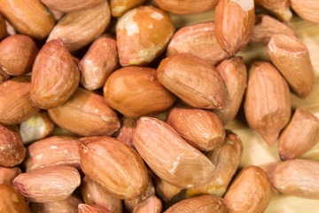 Isolated peanut. Walnut purified on a woodenbackground. Protein food. Raw peanuts.