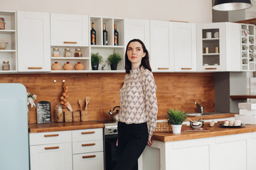 Stock photo portrait of a pensive attractive woman with middle-length dark hair wearing