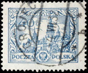 Grójec. Kasownik pocztowy (1932) odbity na znaczku pocztowym, przedstawiającym Wawel w Krakowie.
