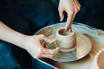 Hands of a potter at work