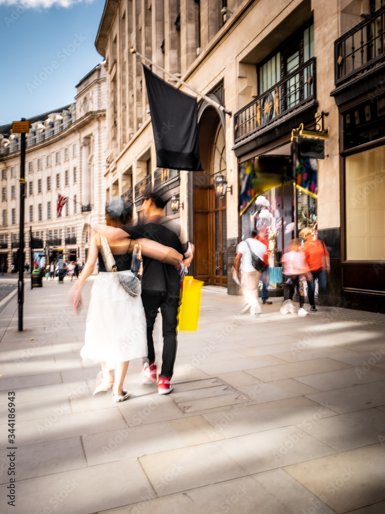 Wall mural Motion blurred London shopping street