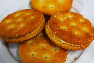 Round crackers stuffed with peanut butter