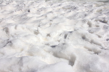 Textured white snow on a beautiful sunny day