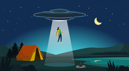Alien abduction: ufo kidnapping a woman at night © elenabsl