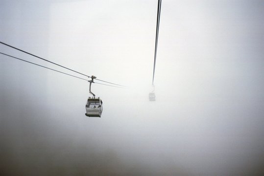 Overhead Cable Car Against Sky