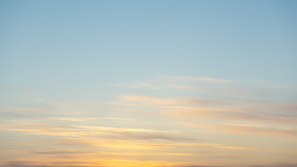 Beautiful clear, morning sky at sunrise, natural background. Soft pink clouds.