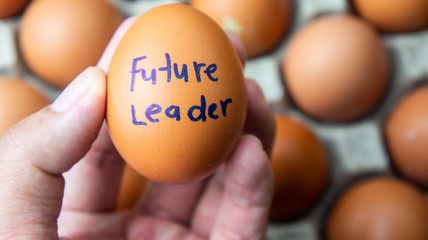 Egg with text future leader. Talent development concept