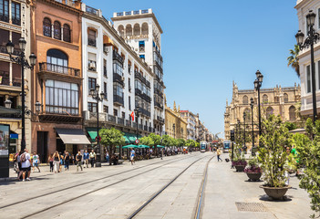 Street with rails for tram in the city center of Seville