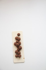 Chocolate truffle candie. Minimal concept above decoration on white food background. Chocolate Candy,