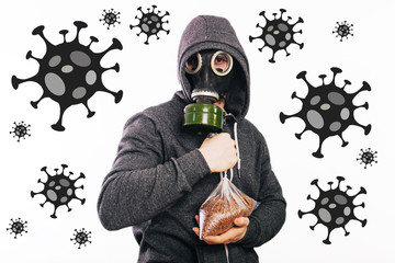 A guy in a gas mask and a gray hoodie is holding a packet of buckwheat. The stink in the toilet....