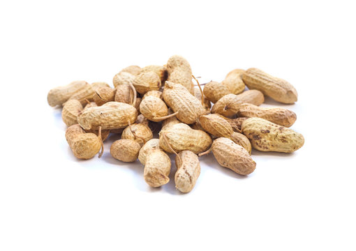 Inshell peanuts heap on white background
