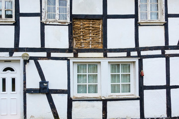 GERMANY, NORTH RHINE-WESTFALIA, MARIALINDEN, front of a typical half timbered house of the region with a section showing the inner structure of the wall-construction.