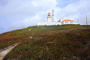 Fototapeta na wymiar Lighthouse on Cabo da Roca on cloudy day, Portugal.