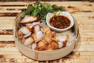 Deep Fried Crispy Pork Belly Cooked with Garlic and spicy dipping sauce.