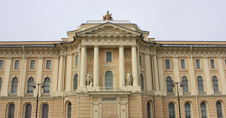Russian Imperial Academy of Arts in Saint Petersburg. Main building architecture on the Academy quay, decorative facade details with old sculptures and ancient pillars