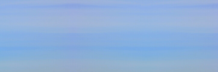 Blue cloudy sky background. Empty pale blue sky texture wallpaper, elongated bluish cloudscape banner. Wide sky template, blank environment template