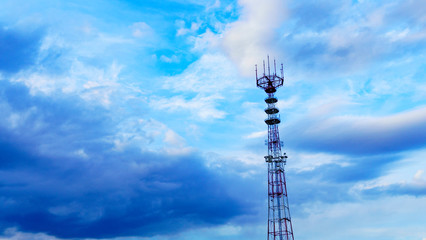 Obraz premium Panoramic view of big television and radio tower on the classic blue sky background. Space for text.