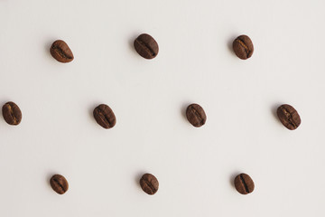 coffee beans on a white background pattern top view
