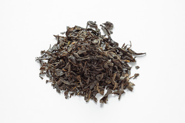 dry tea leaf on a white background, Indian or Ceylon black tea
