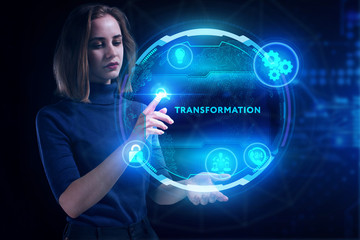 Business, Technology, Internet and network concept. Young businessman working on a virtual screen of the future and sees the inscription: Transformation