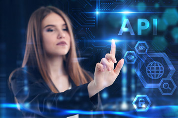 Business, Technology, Internet and network concept. Young businessman working on a virtual screen of the future and sees the inscription: API