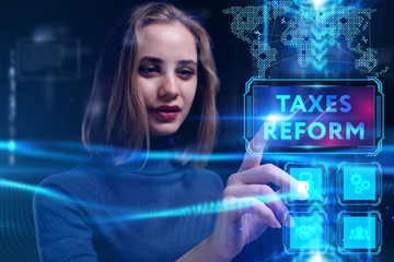 Business, Technology, Internet and network concept. Young businessman working on a virtual screen of the future and sees the inscription: taxes reform