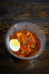 Take out Korean food Stir-fried Rice Cake Tteok-bokki in microwaveable container.