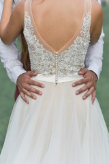 Groom holding his bride
