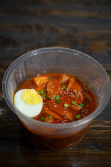 Take out Korean food Stir-fried Rice Cake Tteok-bokki in microwaveable container.