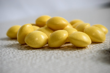 yellow round vitamins lie on a white surface. The concept of prevention and care for your health
