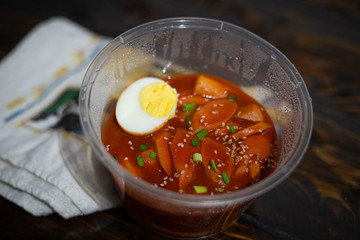 Take out Korean food Stir-fried Rice Cake Tteok-bokki in microwaveable container.