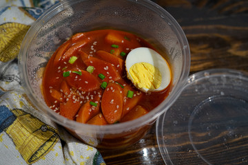 Take out Korean food Stir-fried Rice Cake Tteok-bokki in microwaveable container.