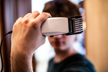 Hair cutting with a hair clipper at home