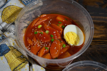 Take out Korean food Stir-fried Rice Cake Tteok-bokki in microwaveable container.