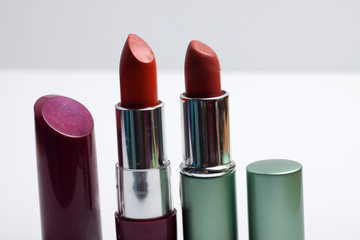 Close up shot of red lipstick on a white background