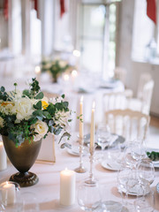 wedding decor, served tables, ivory, with candles, glasses, beautiful wooden tables, inside the Italian old Villa
