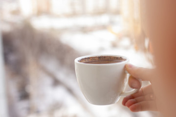 cup of coffee in hand