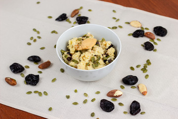 Millet porridge with raisins, prunes and pumpkin seeds