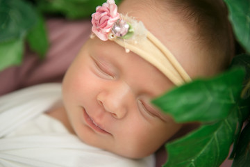 Sleeping beautiful newborn baby girl