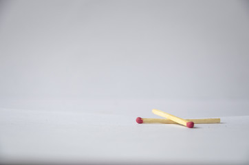 Two lying matches on a white background.